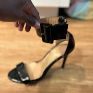 Patent leather 3 inch high heel with ankle strap.